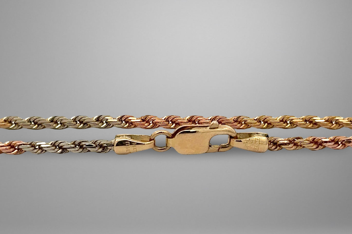Yellow gold, rose gold, & white gold rope chain with 14K yellow gold clasp