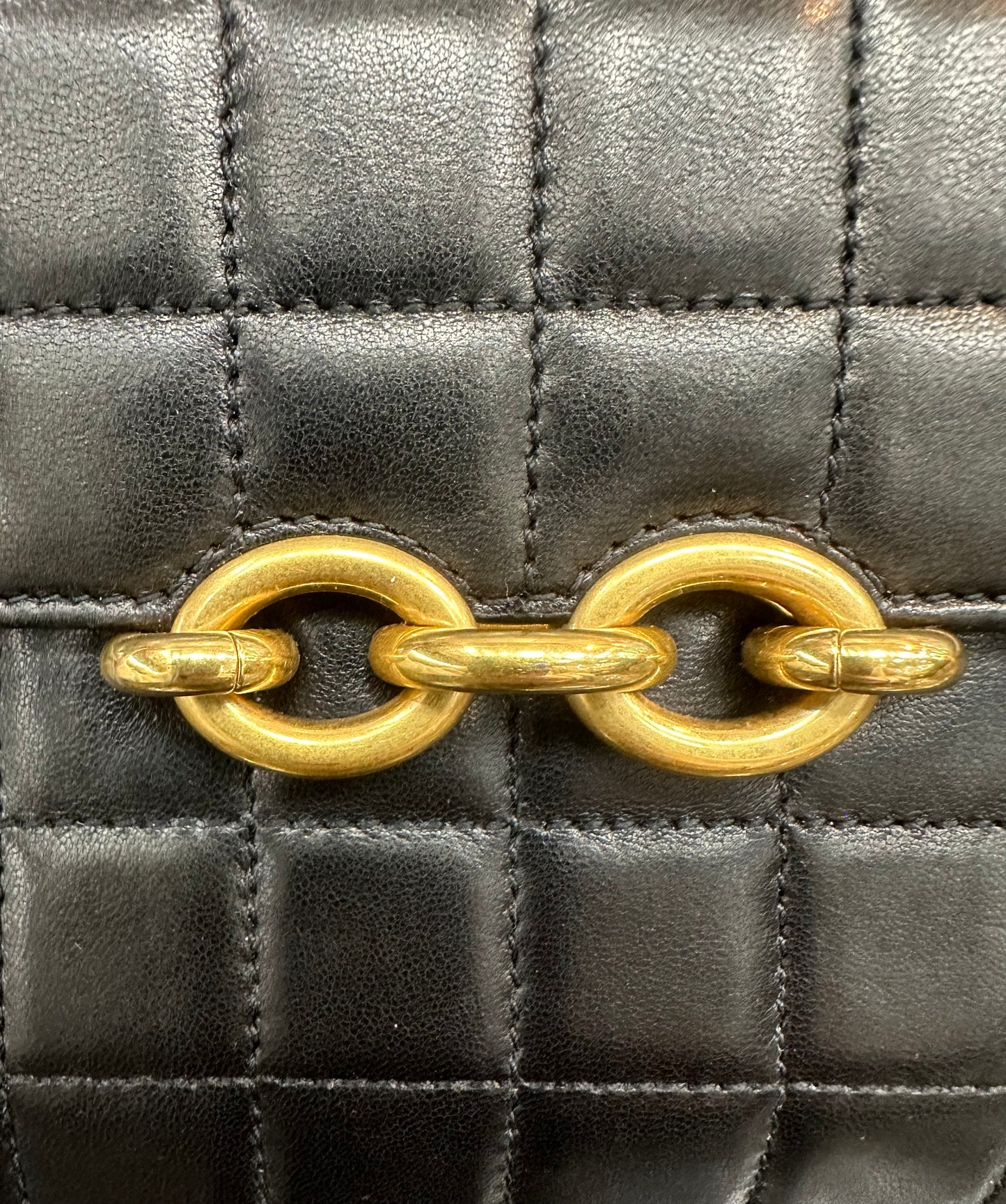 Close up of gold chain link closure