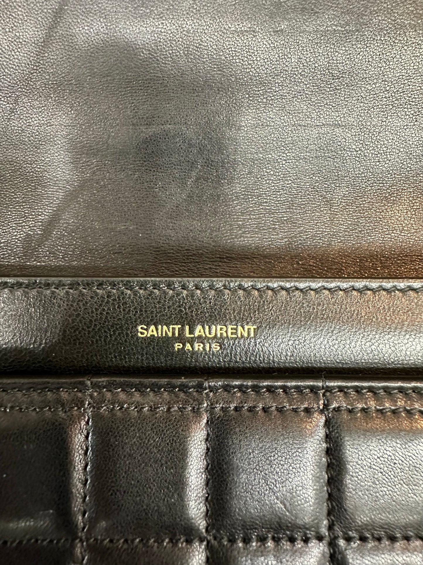 Close up of Saint Laurent logo 