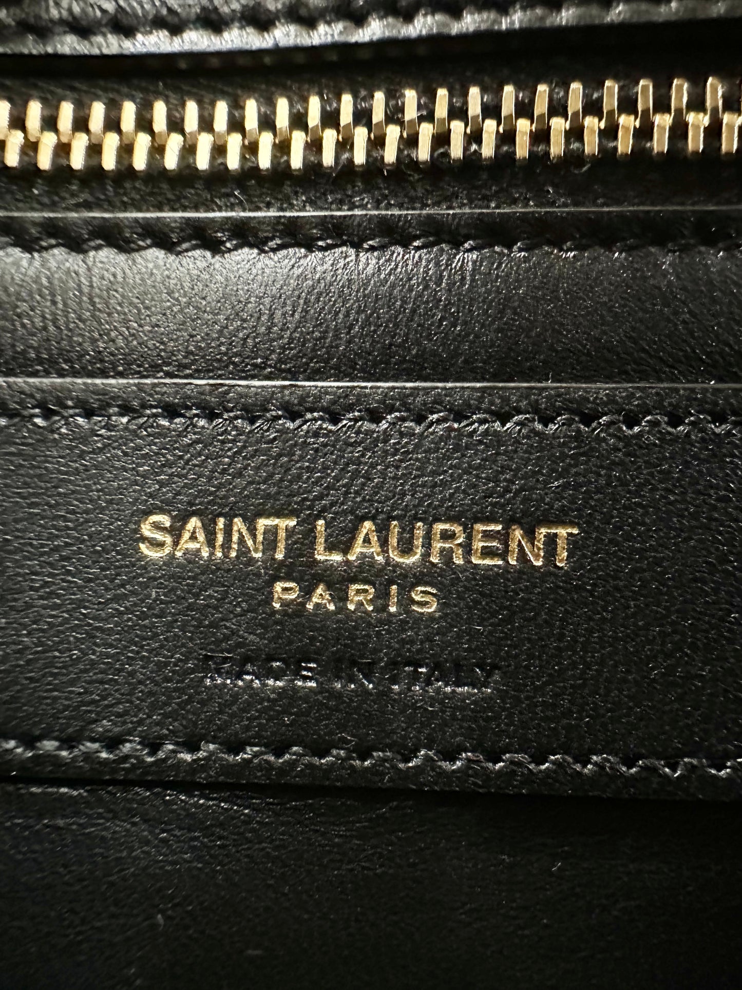 Close up of interior Saint Laurent Paris "Made in Italy" logo