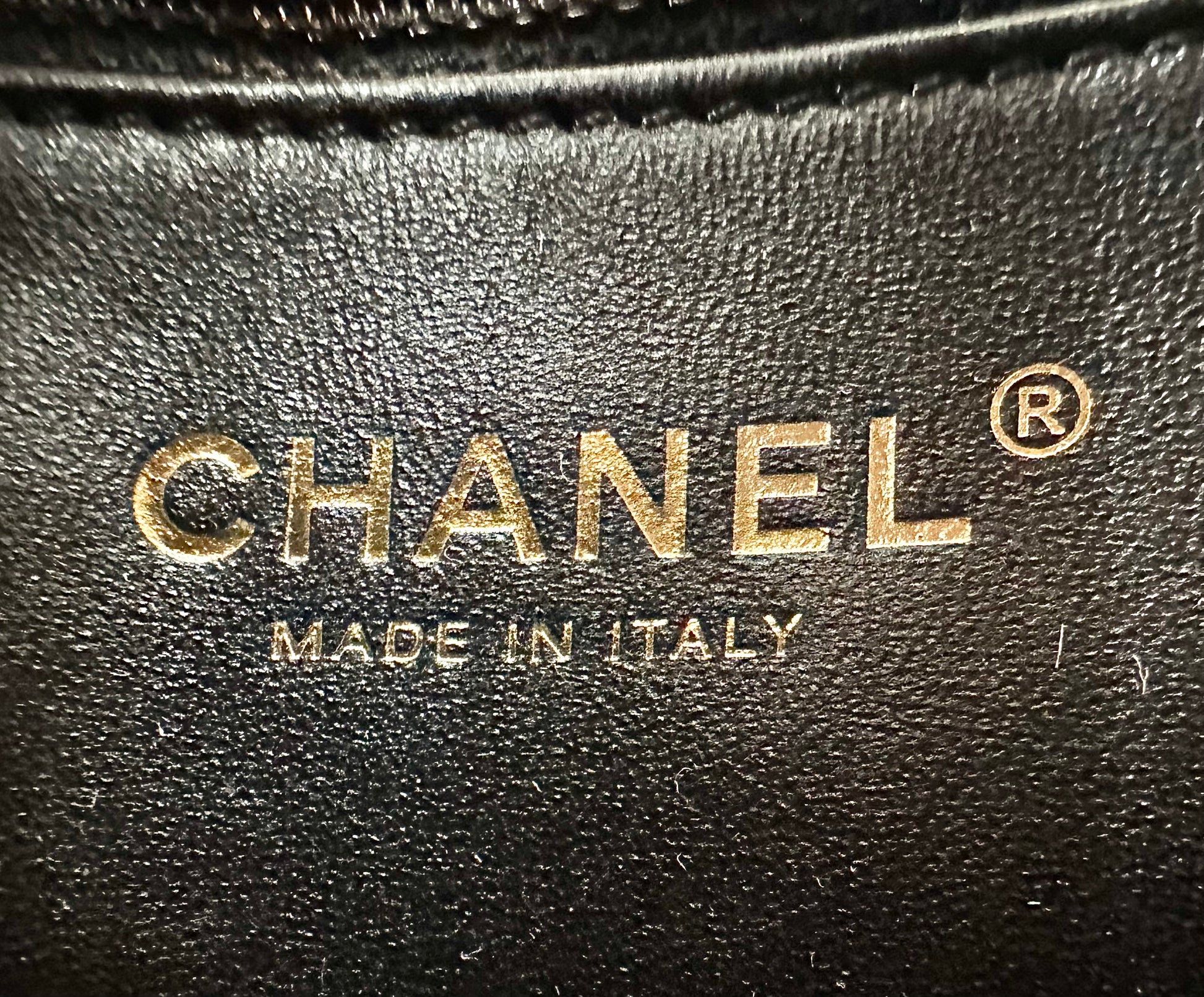 Chanel logo on inside of bag with Made in Italy below it.