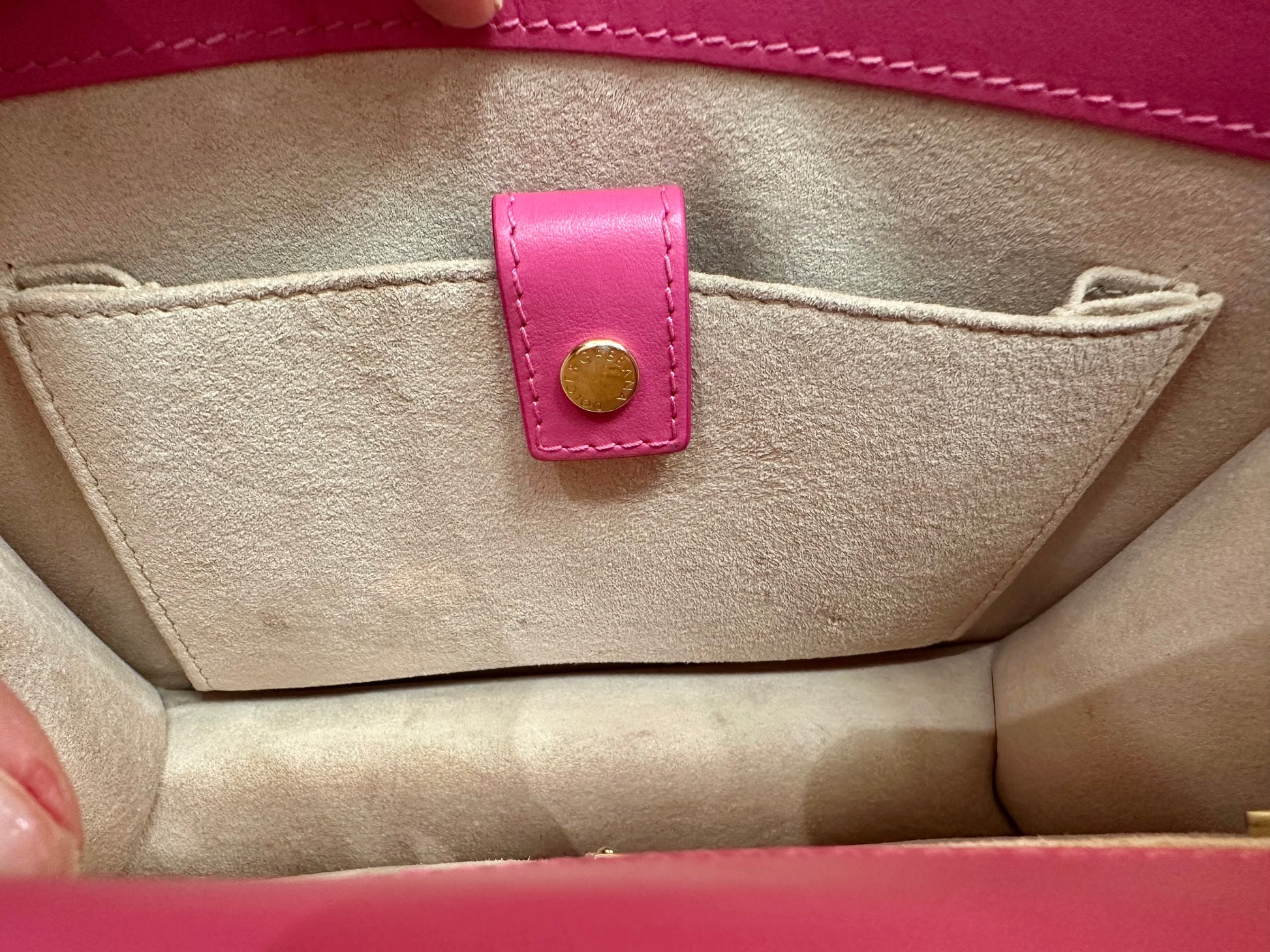 Interior pocket with snap button closure