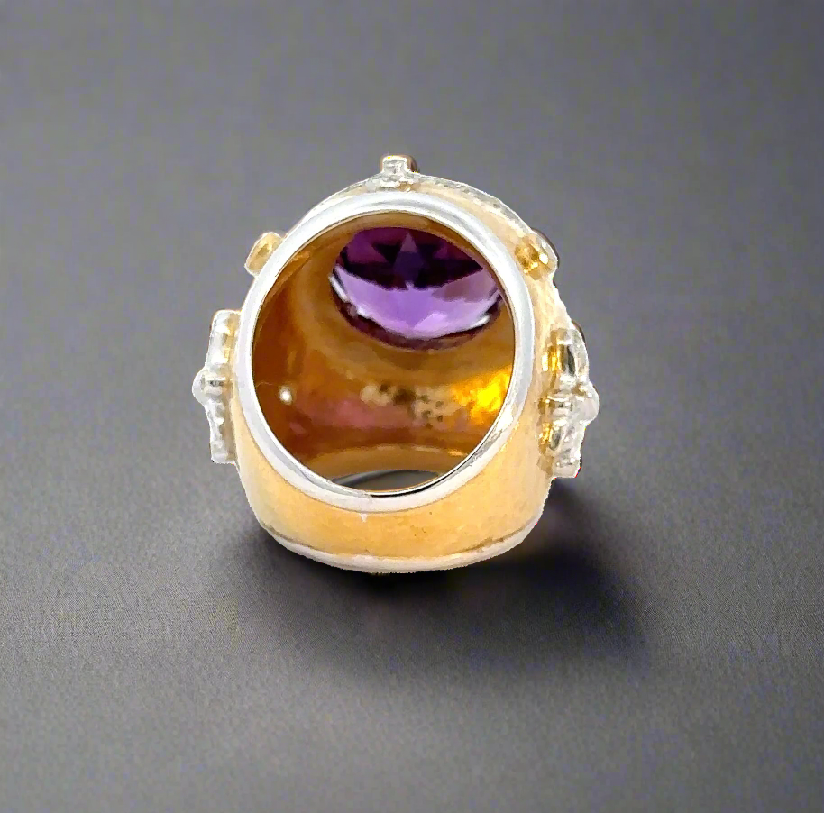 The bottom of the shank and the inside of the amethyst ring. Some scratches on the band and in the inside of the ring.