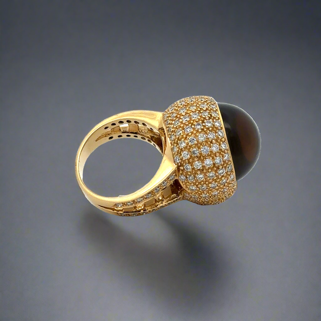 The back of the skull ring showing the diamonds, back of the gemstone, and the shank. Small scratches on the shank.