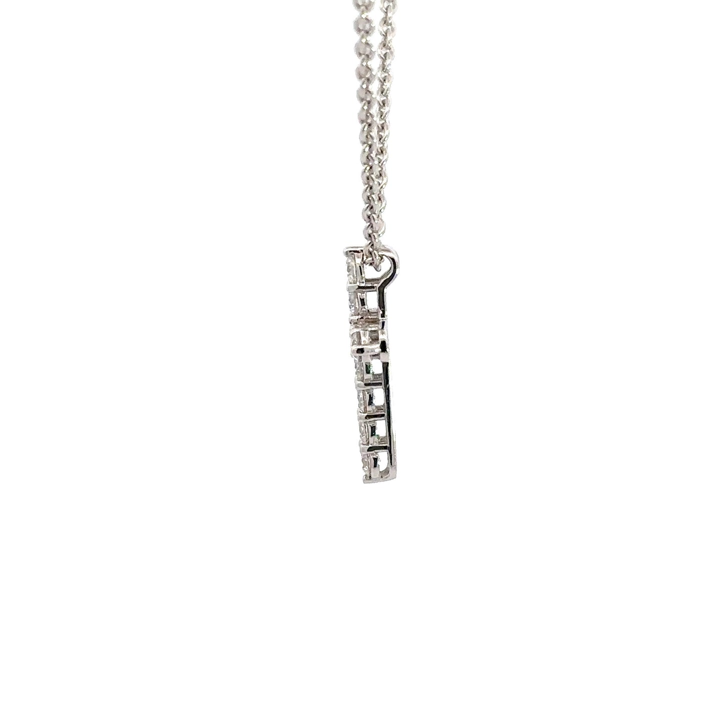 side of white gold cross necklace with attached bail