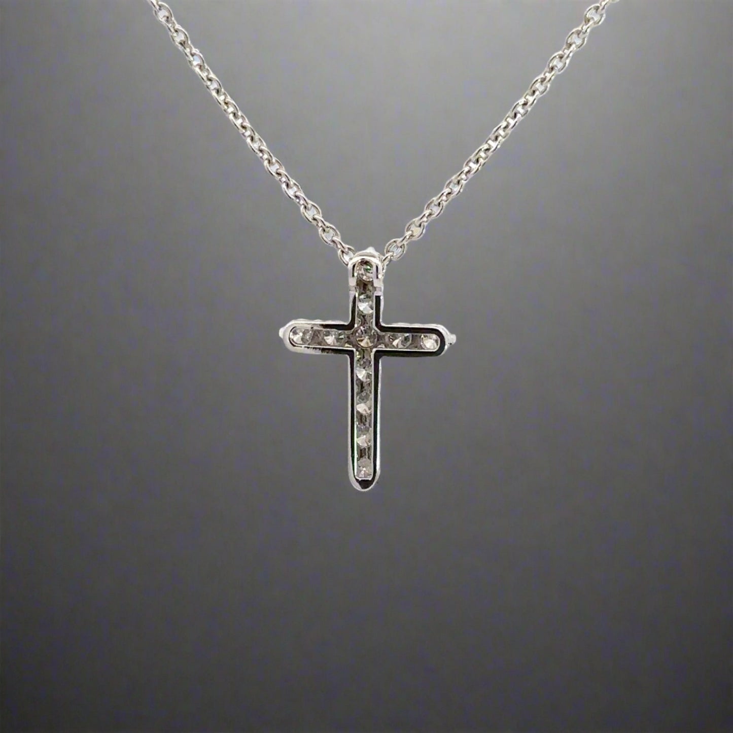 back of white gold cross necklace