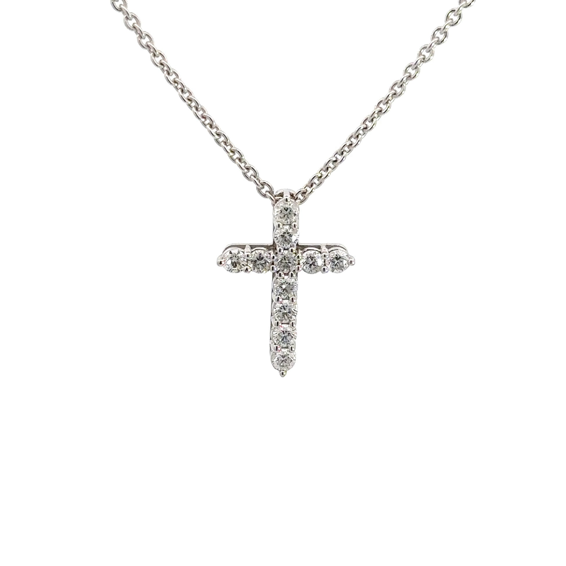 front of white gold diamond cross with 11 small round diamonds