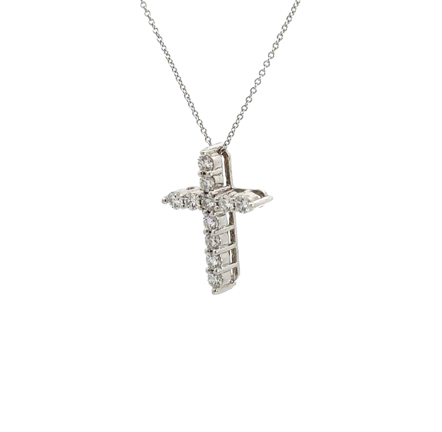diagonal view of white gold cross necklace
