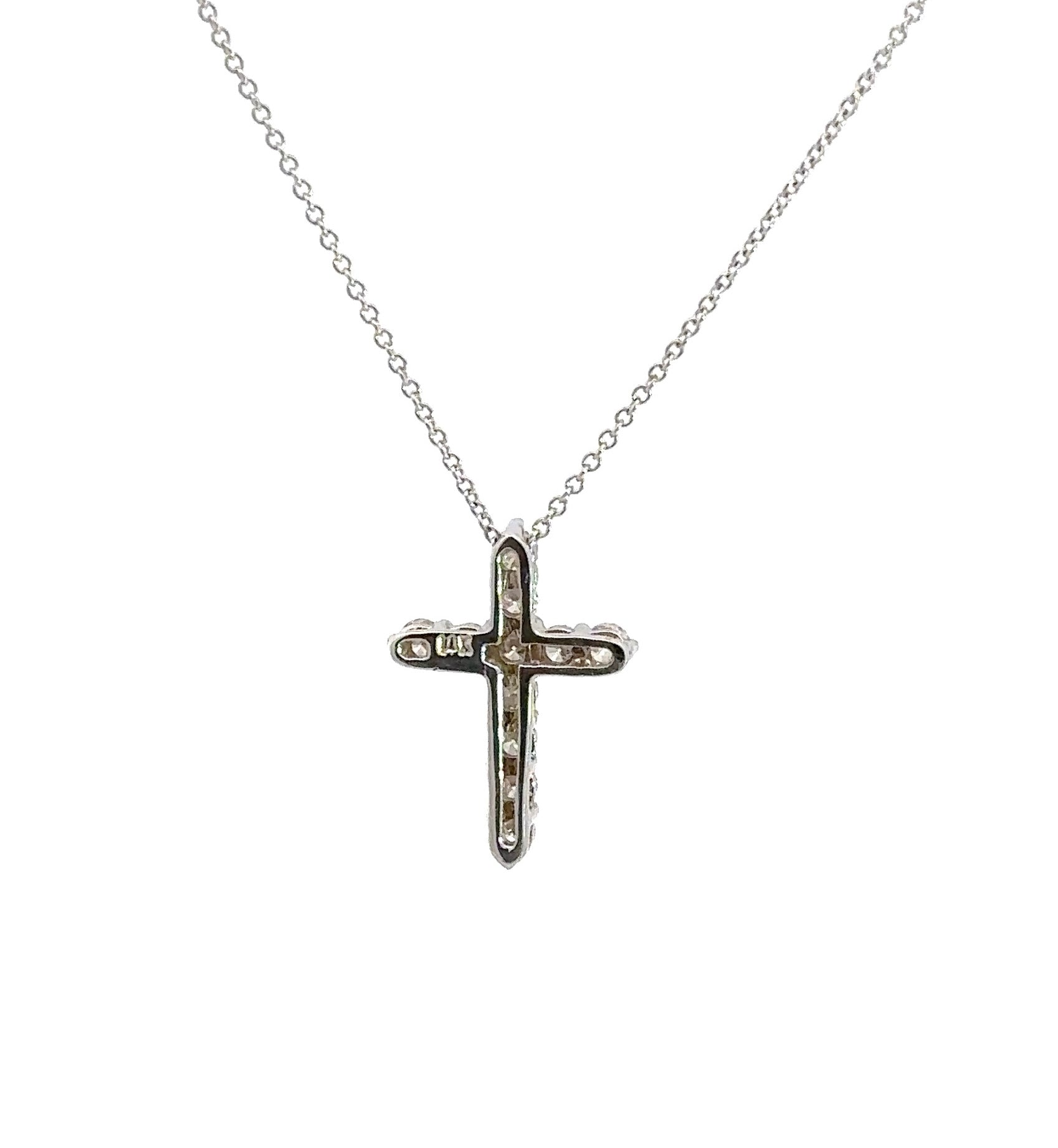 back of white gold cross with a 14K stamp