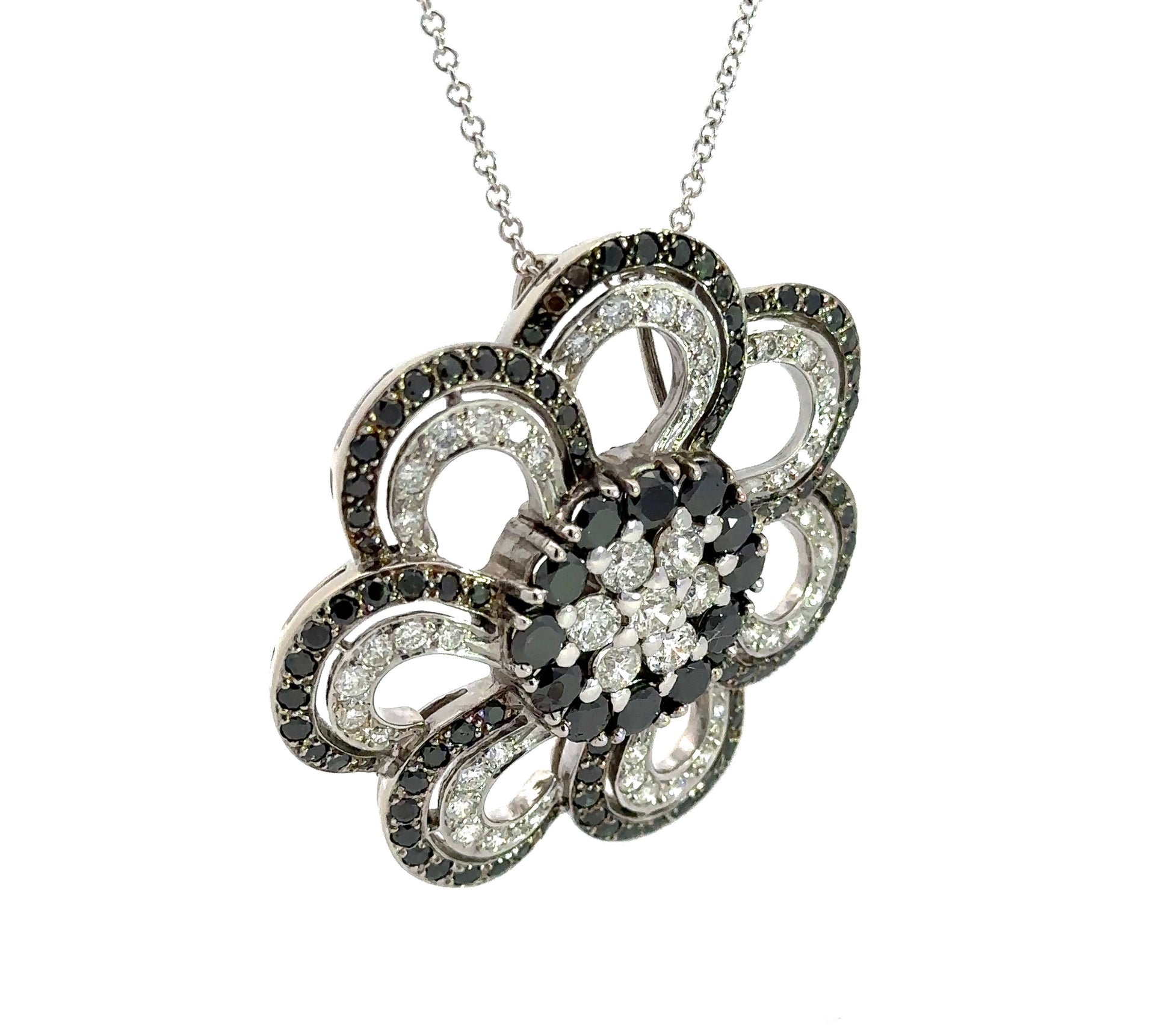 diagonal view of black and white diamond flower necklace
