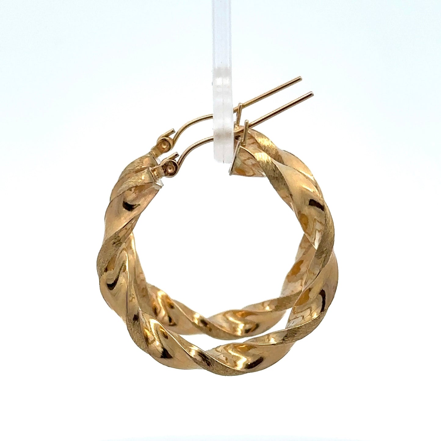 side view of yellow gold twist hoops