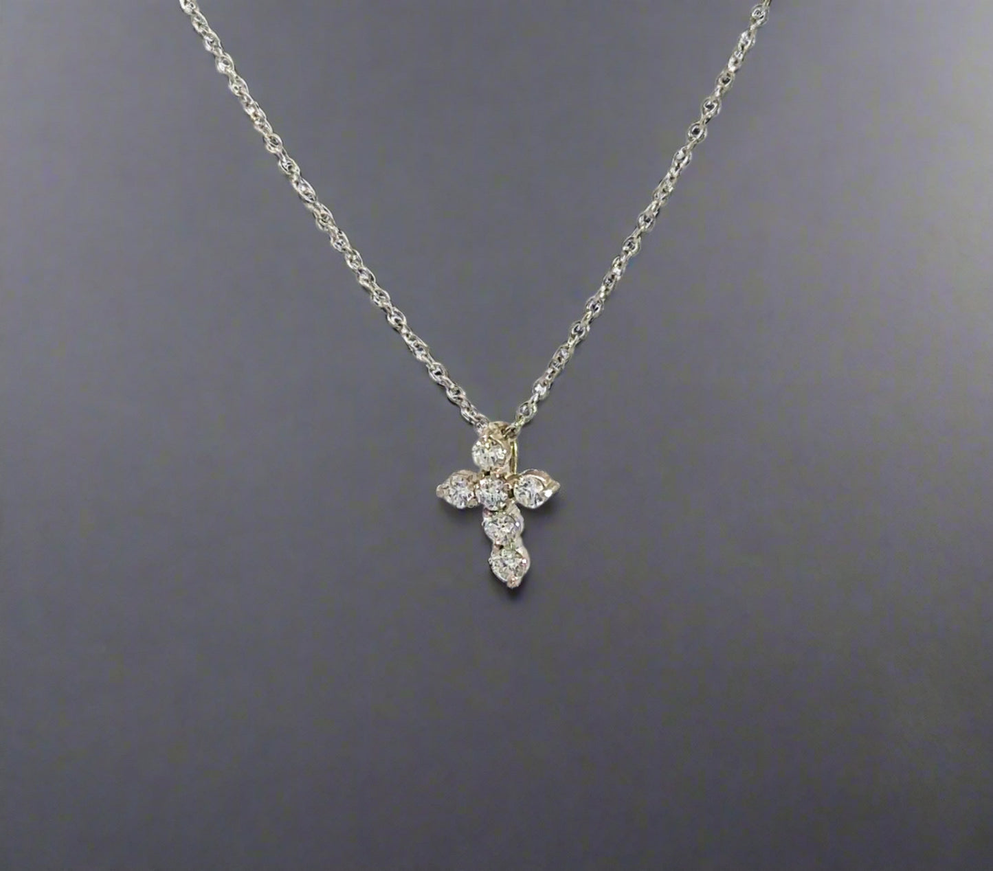 diagonal view of diamond cross necklace