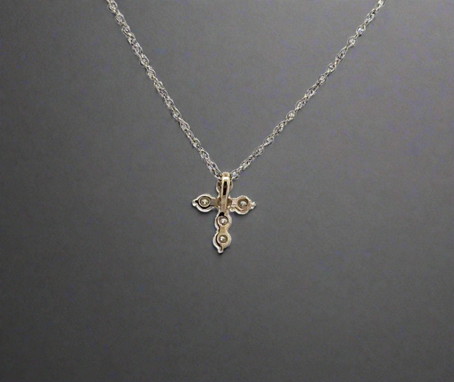back of white gold cross necklace