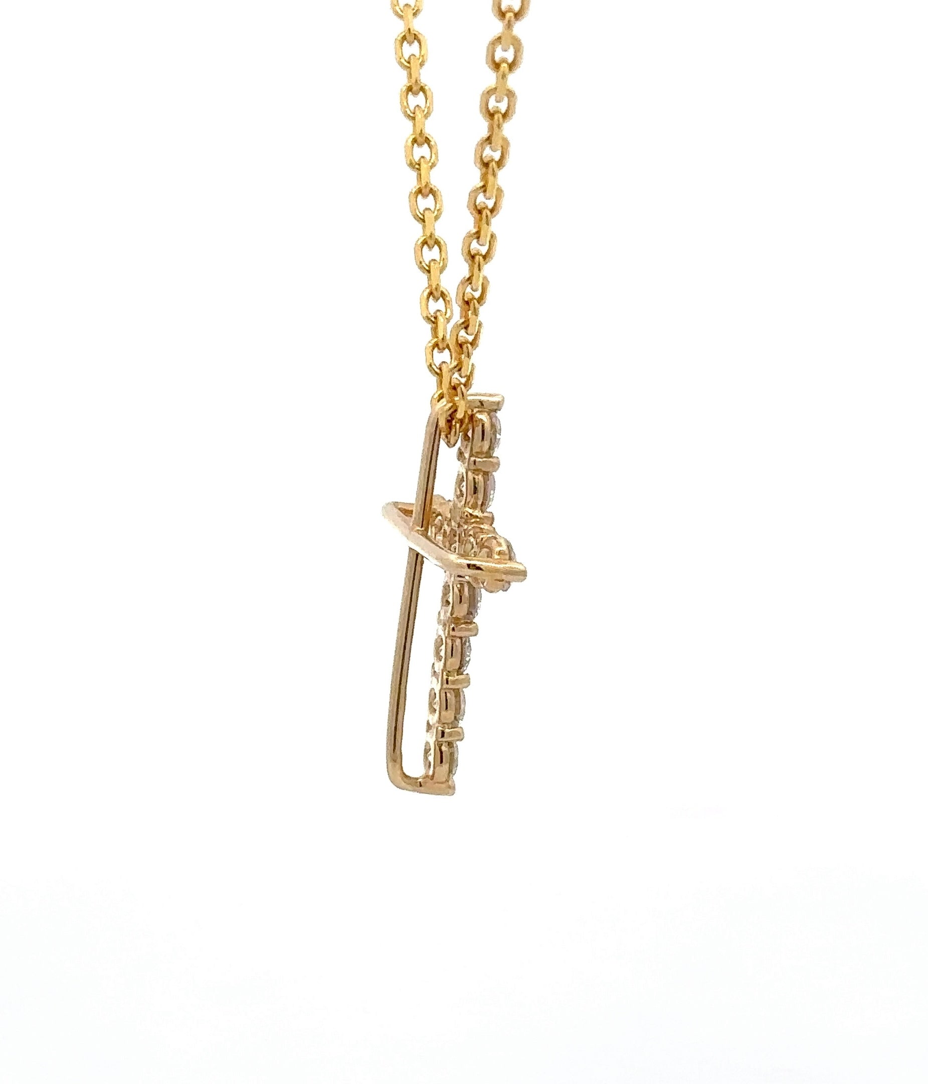side of yellow gold cross necklace