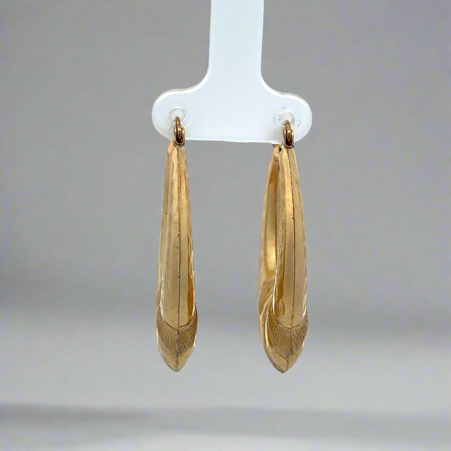 front of yellow gold hoops