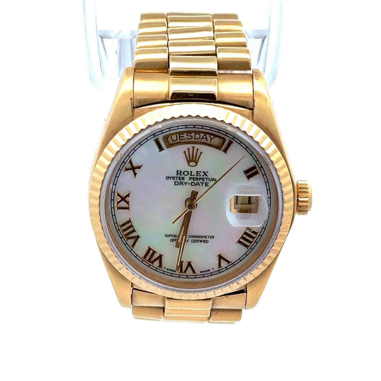 Front of Rolex with white mother of pearl dial and yellow gold case and band