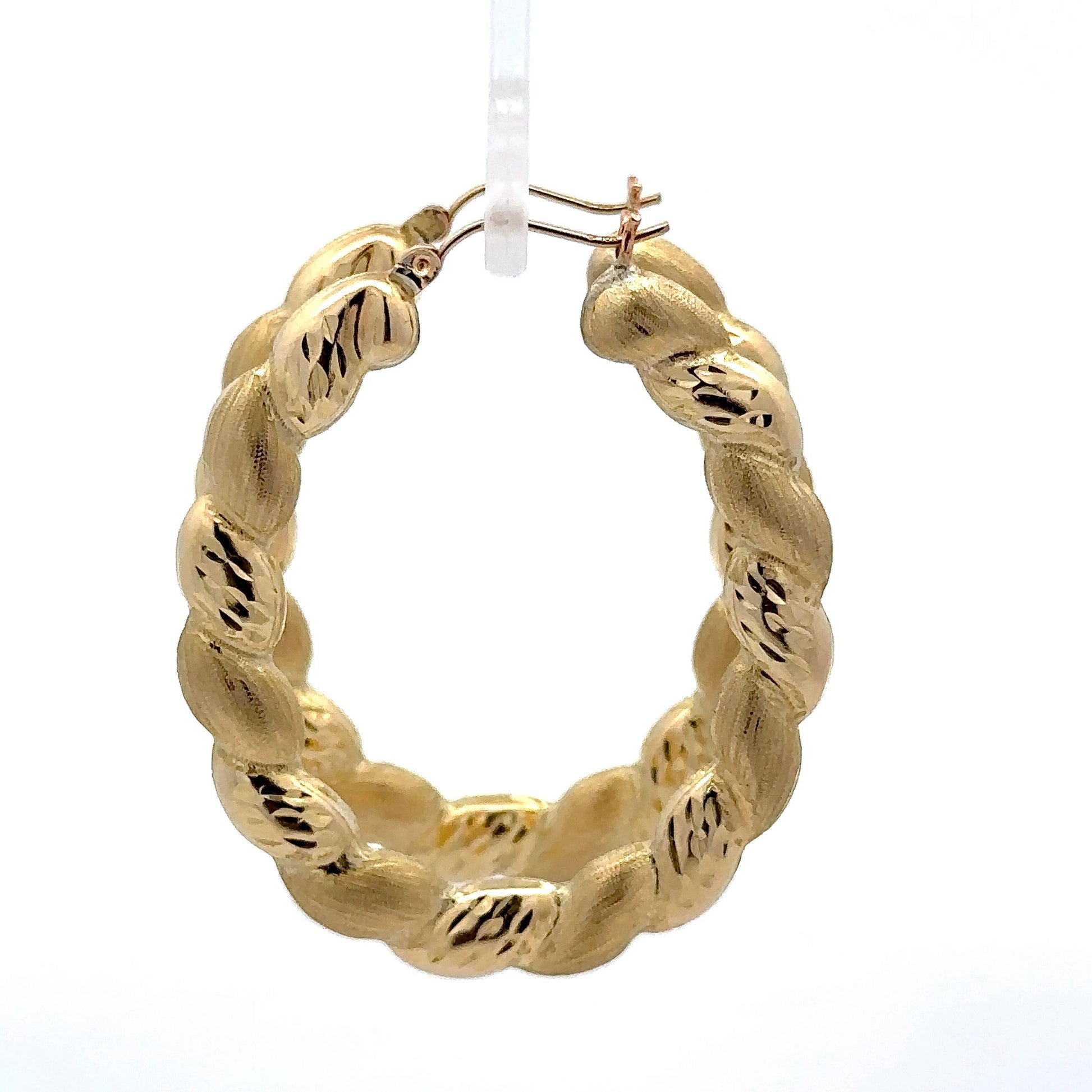 side of yellow gold twist puff hoops