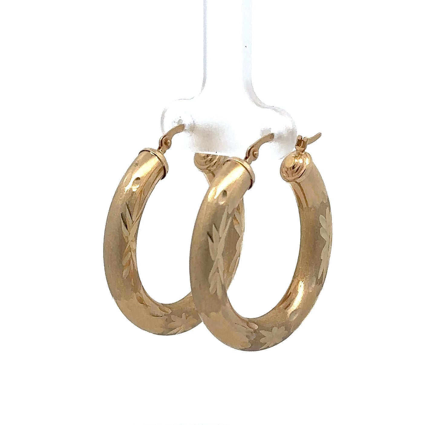 Diagonal view of yellow gold hoops