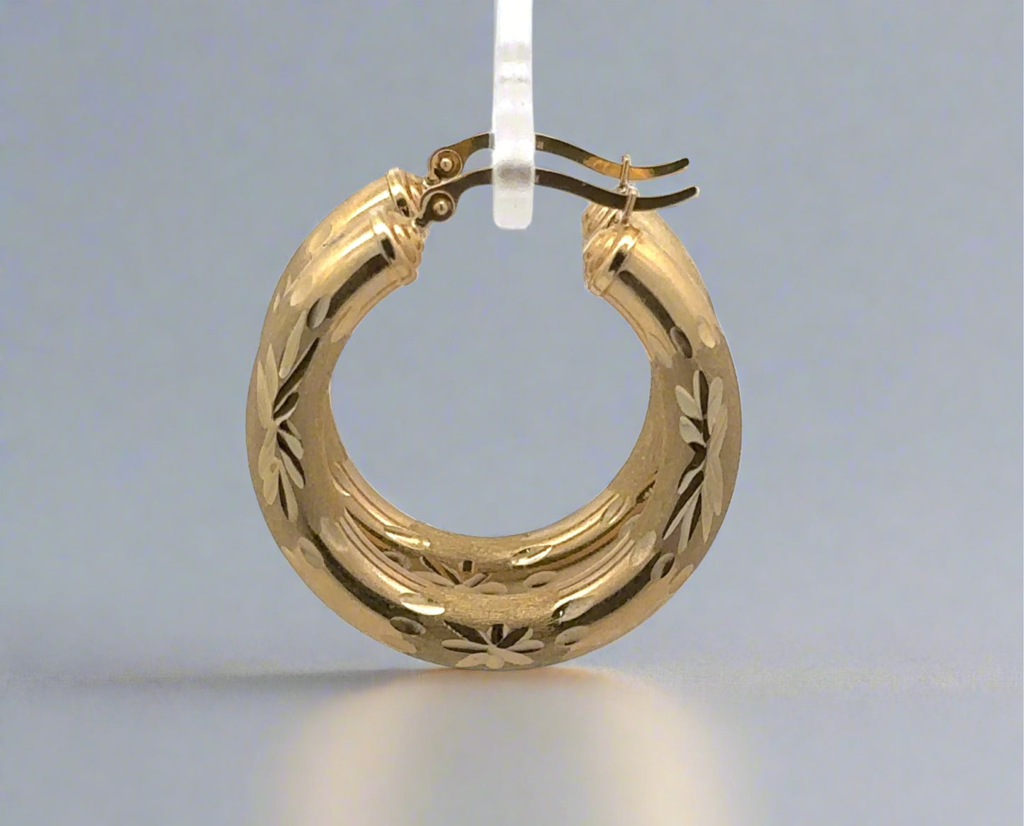 Side of yellow gold hoop earrings
