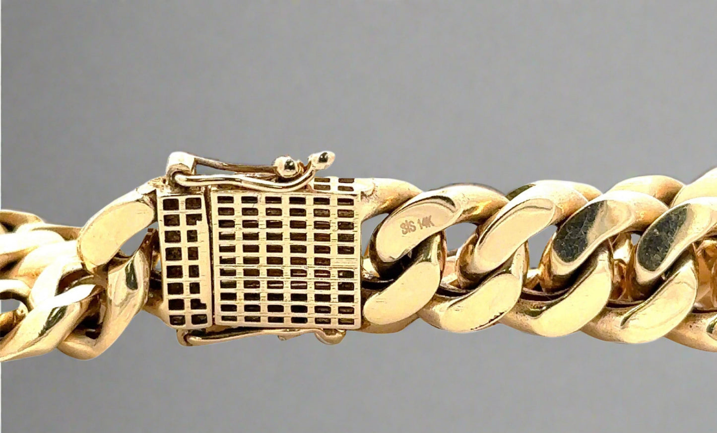 back of box clasp with 2 safety locks and a 14K stamp. Scratches on gold.