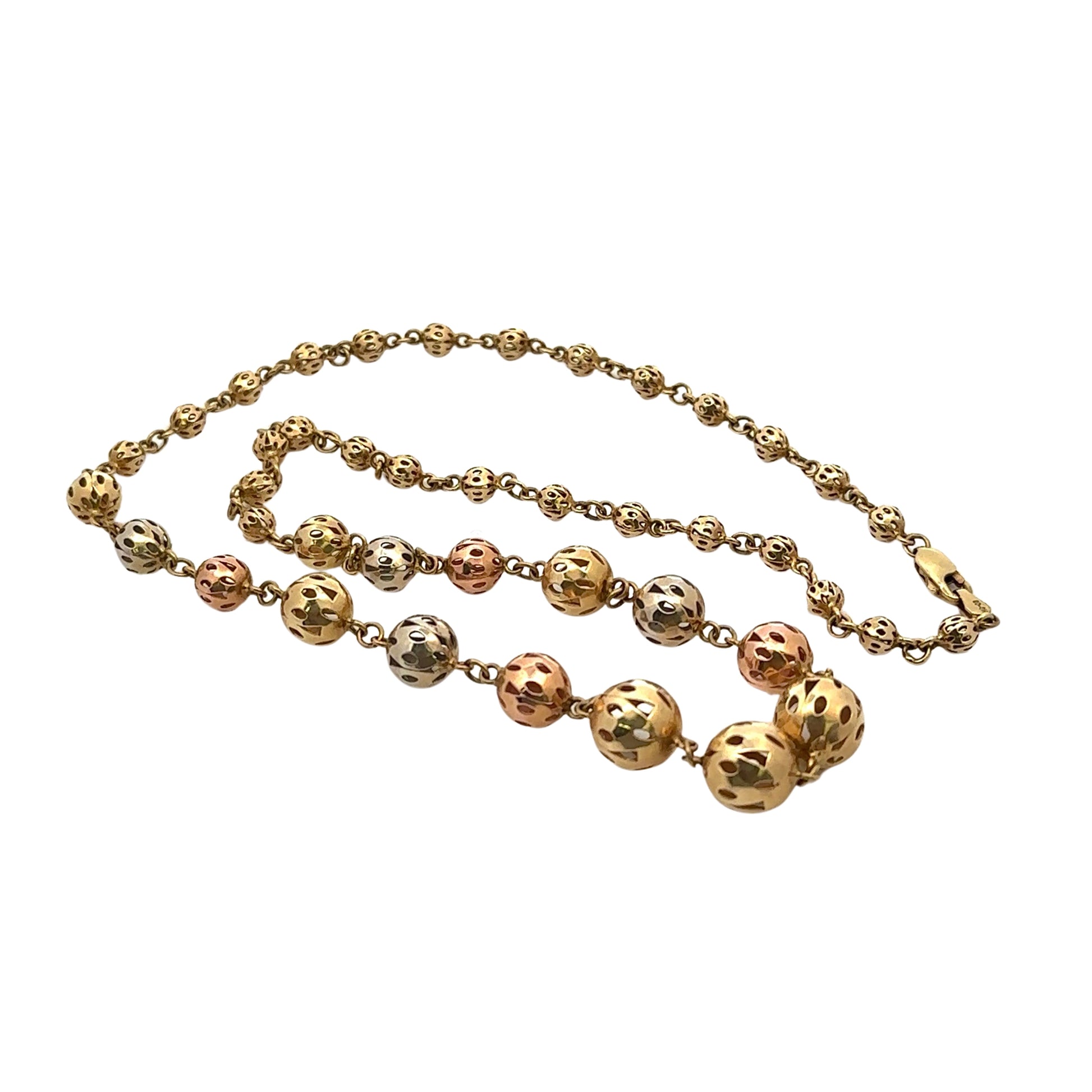 tri-color gold beaded chain lying down