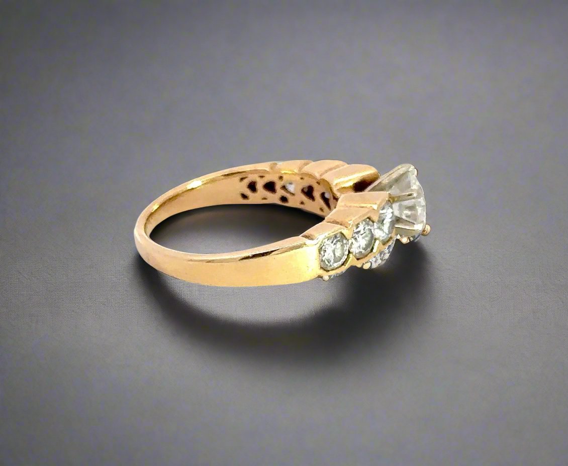 Side of yellow gold ring with scratches on band