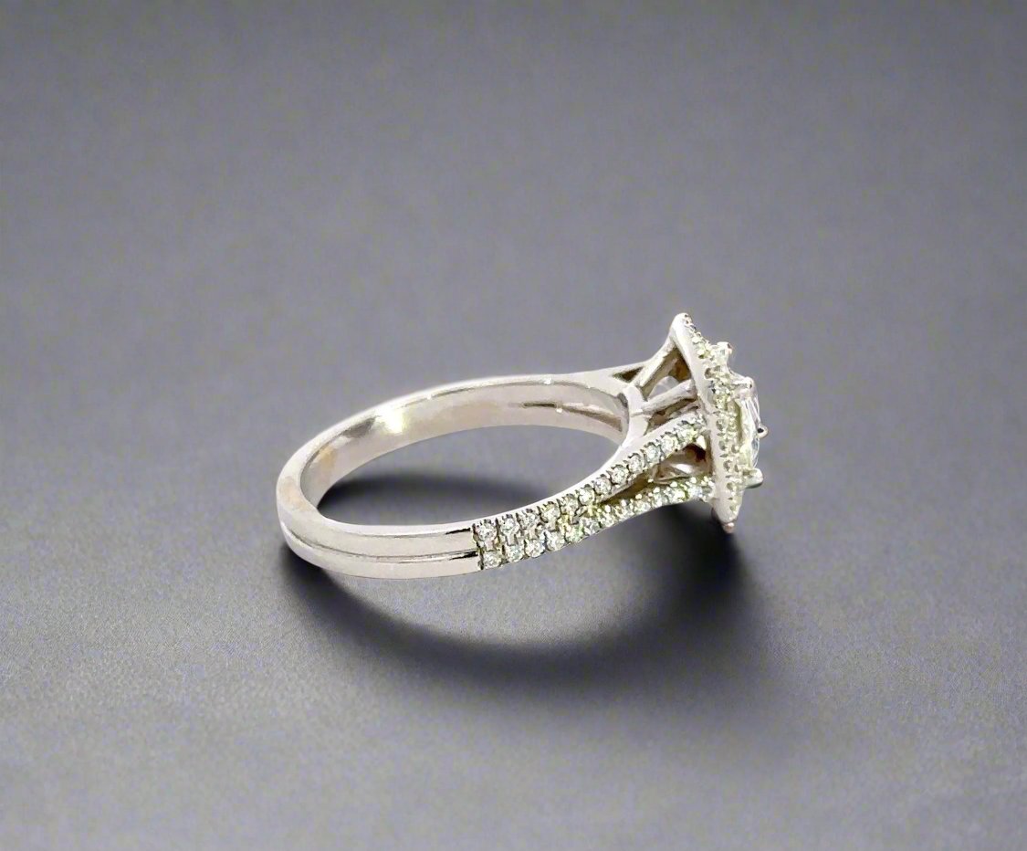 side of white gold ring with small round diamonds on the band