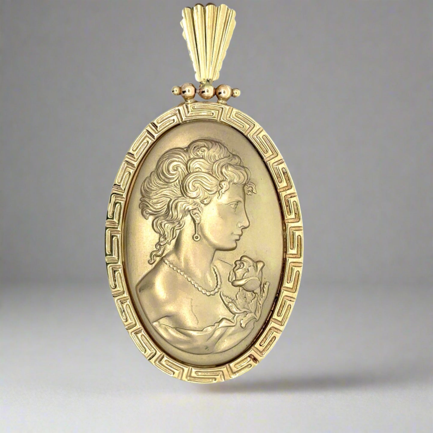 Front of vintage-style lady charm