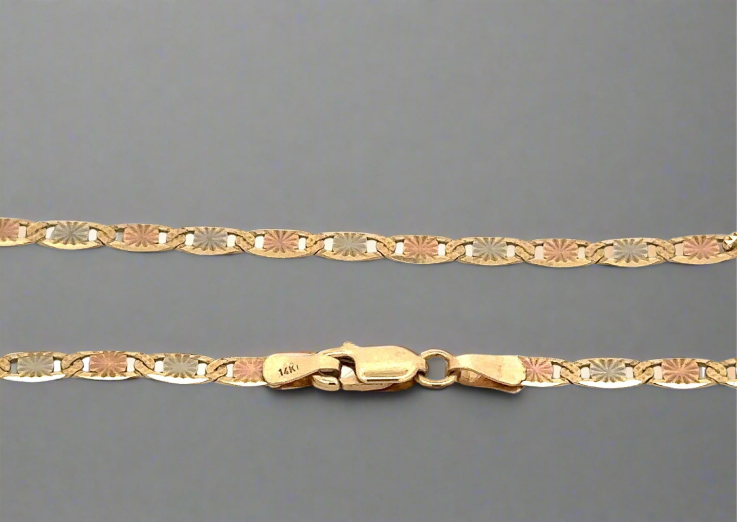 close up of mariner chain with yellow gold clasp and 14K stamp