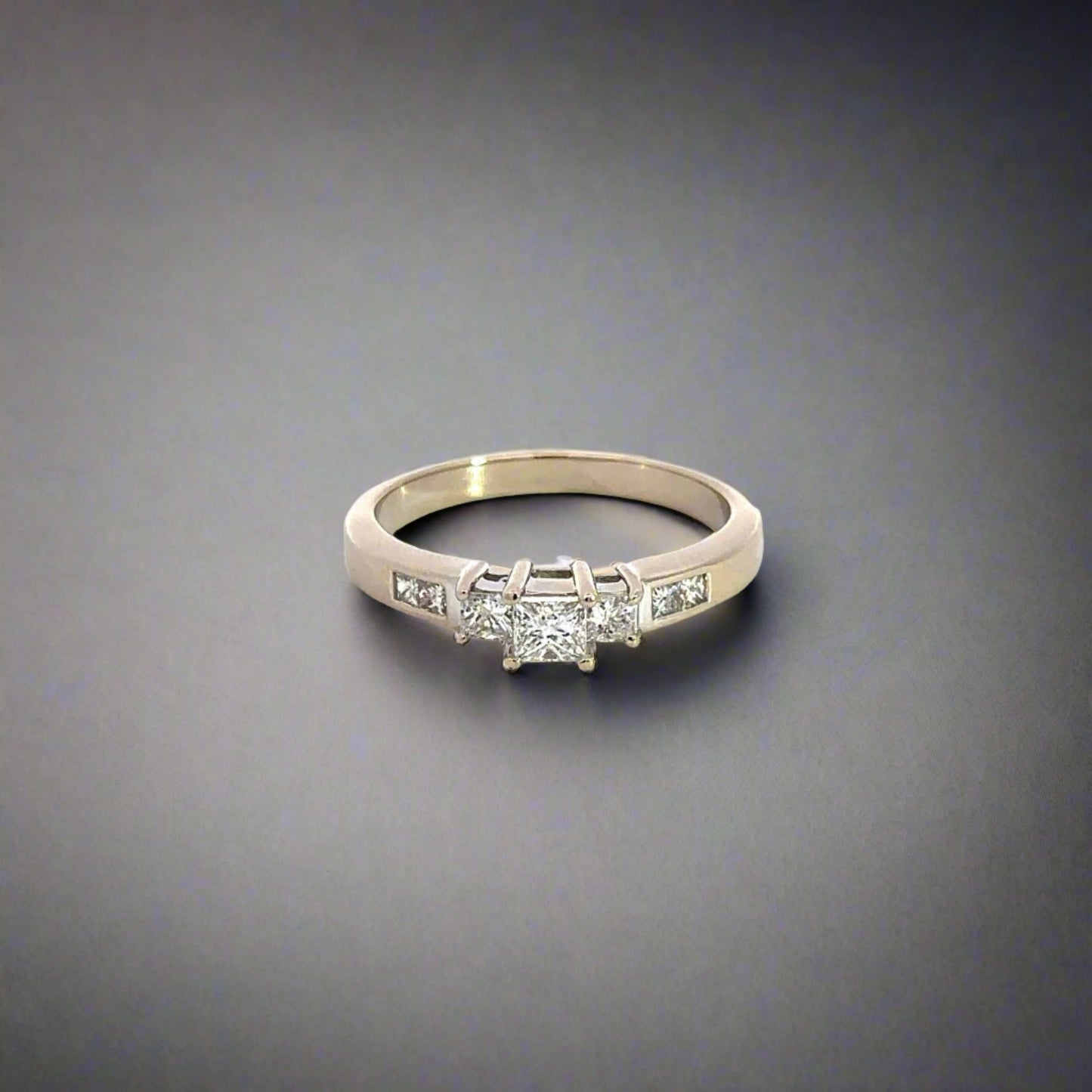 Front of white gold diamond princess-cut ring