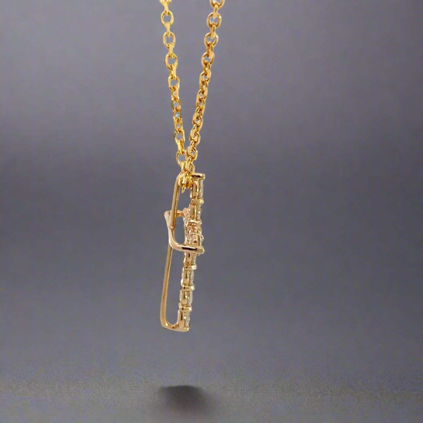 Side of Diamond Cross with open back + cross outline in gold