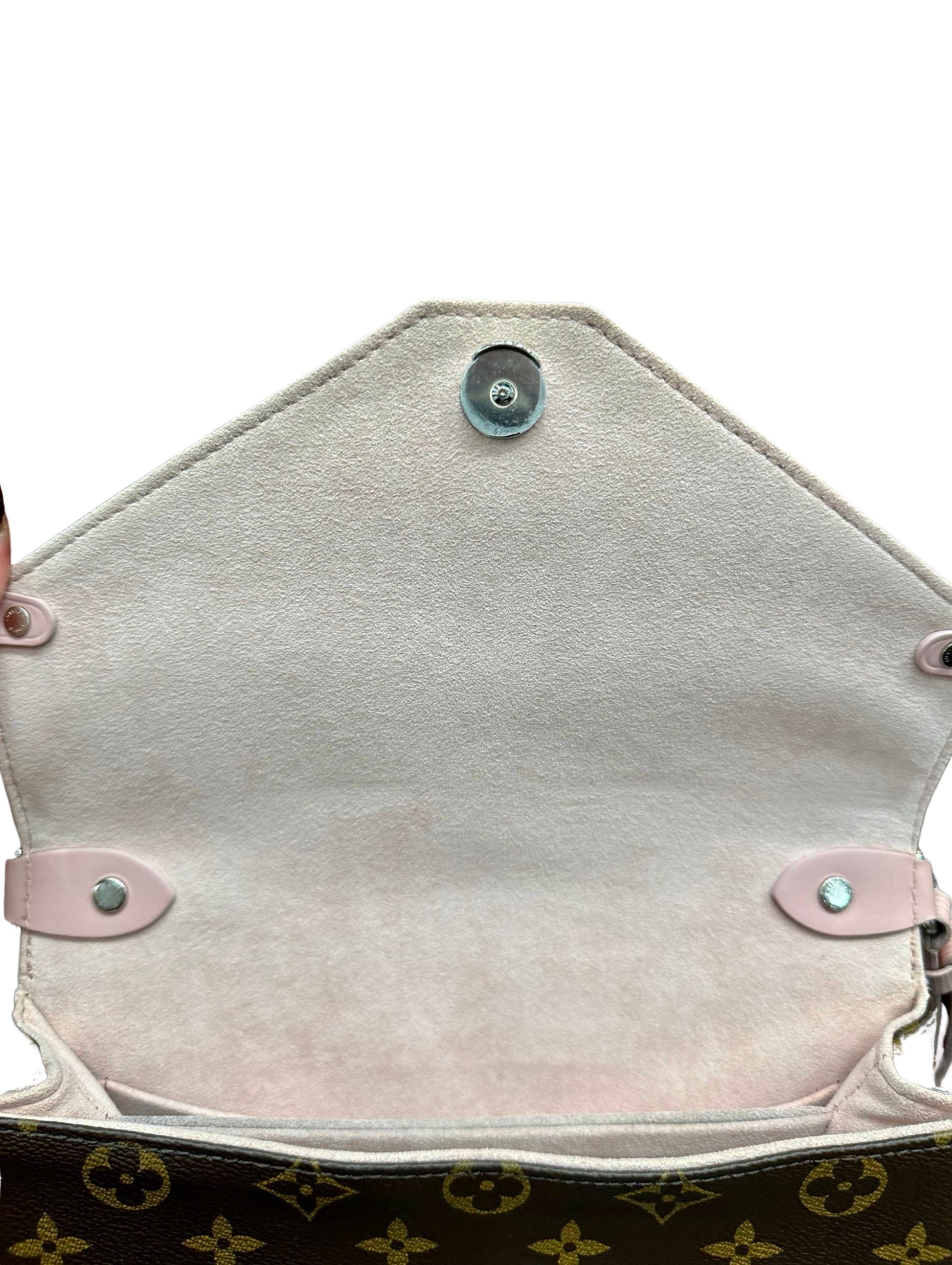 Close up of interior of flap with pink suede and silver hardware. Plastic still on silver hardware closure.
