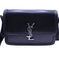 Black leather flap bag with silver YSL logo on front