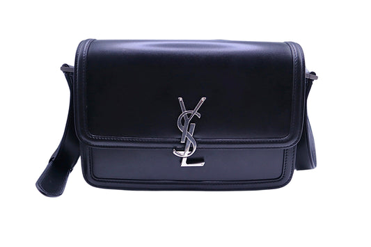 Black leather flap bag with silver YSL logo on front