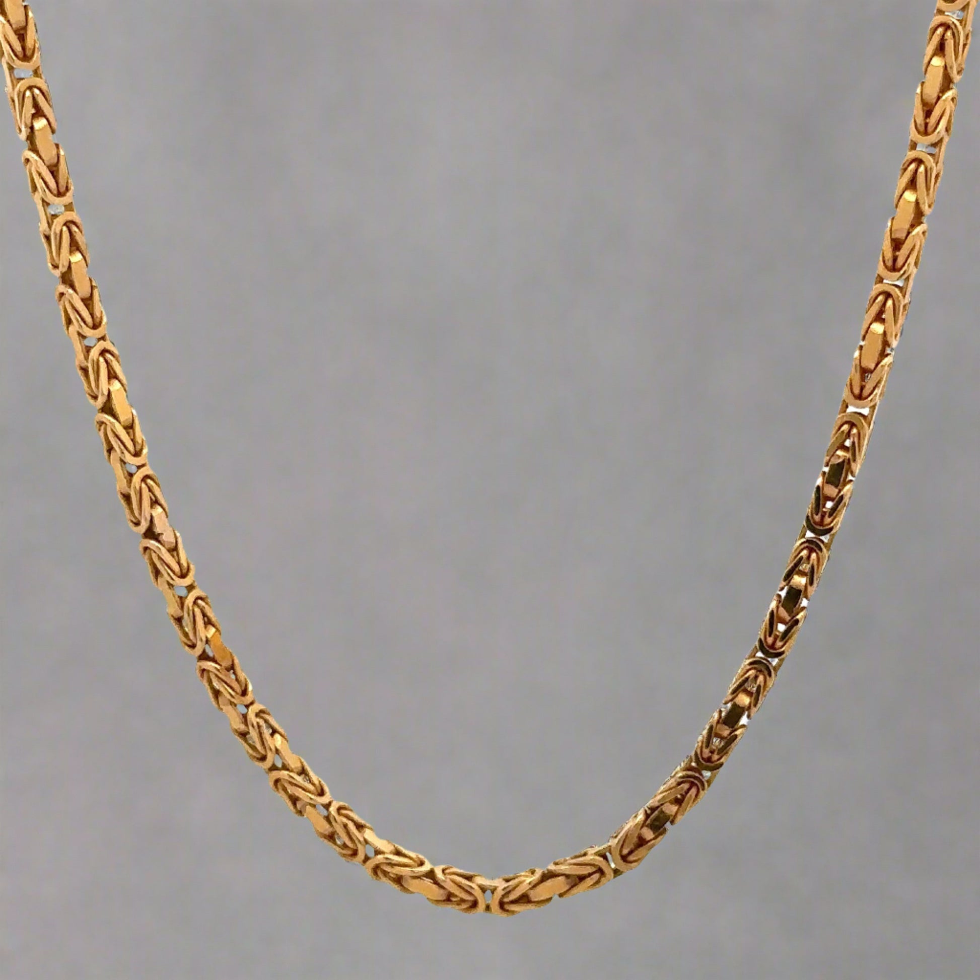 Hanging yellow gold byzantine chain