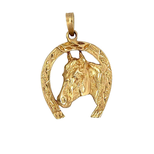 Front of yellow gold horse shoe pendant with a horse head in the middle