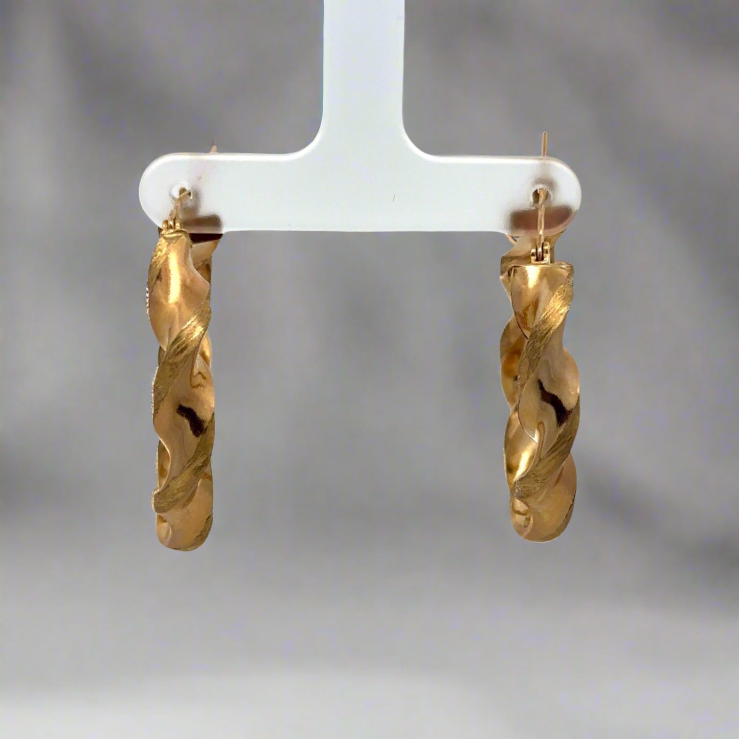 front of yellow gold thick twist hoops