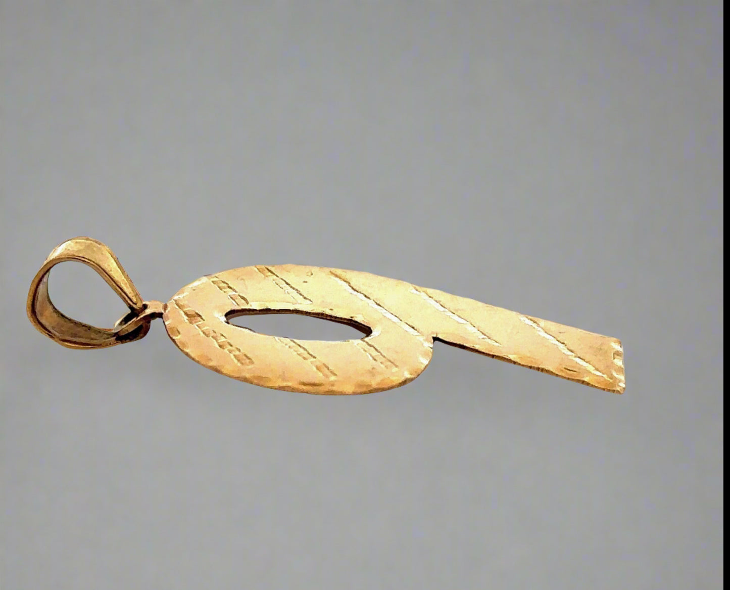 Side of 9 pendant with round bail
