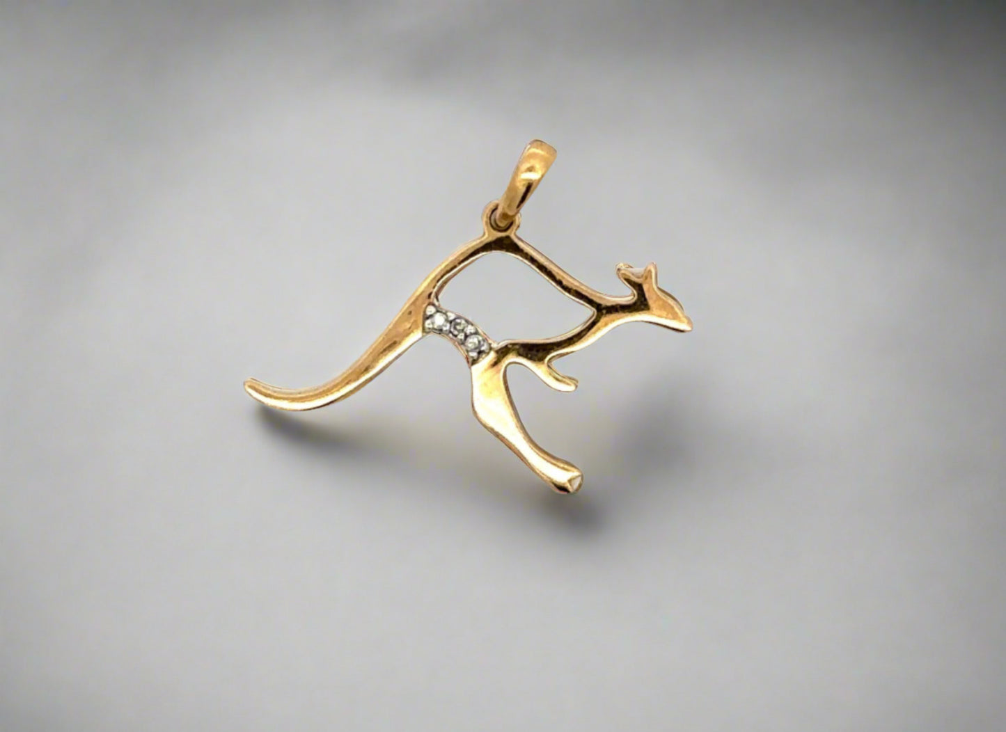 Yellow Gold Kangaroo Pendant with open belly with no gold. 3 small round diamonds on kangaroo