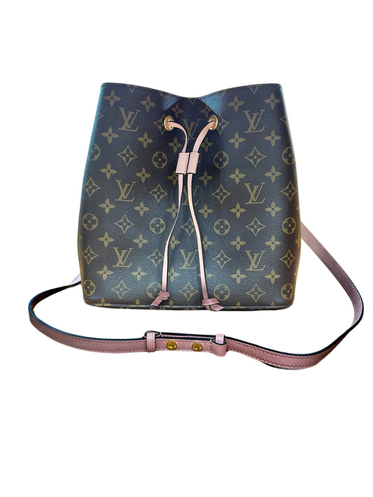 Front of brown bag with iconic LV Monogram + Pink drawstring closure and pink strap