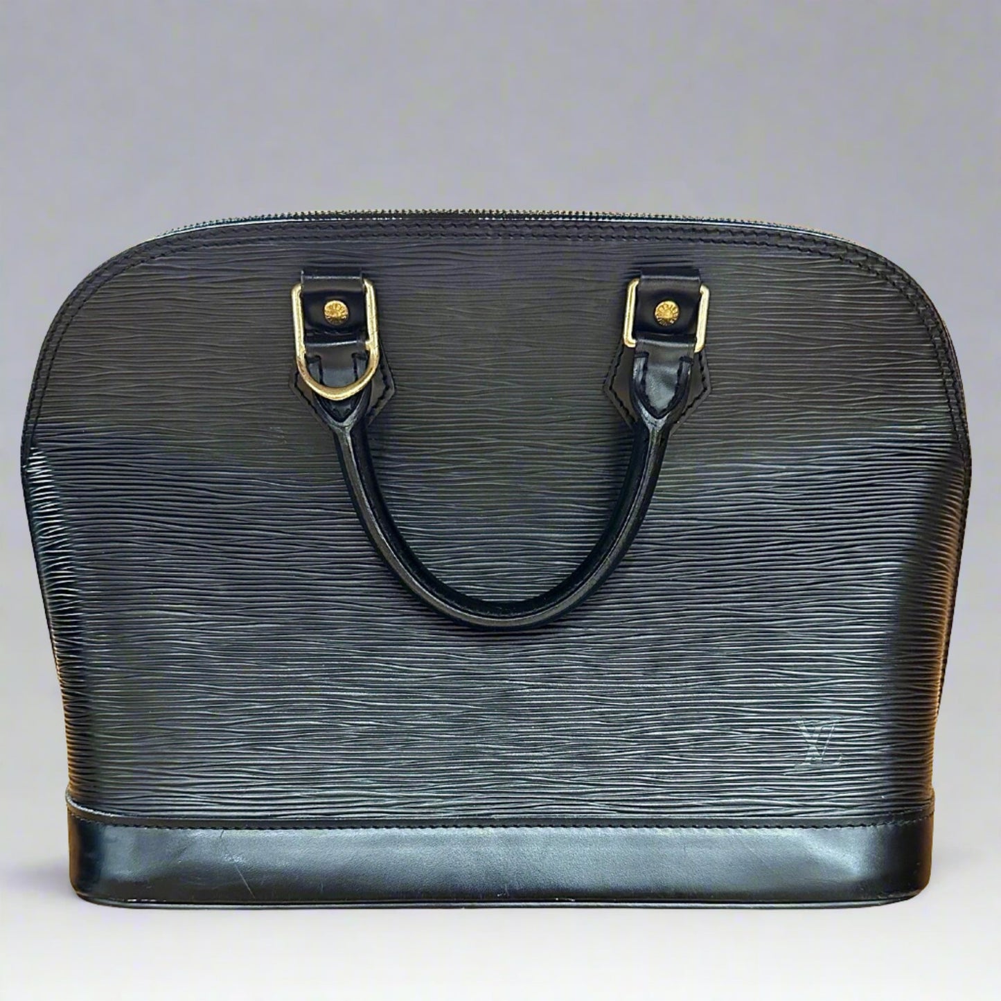 Front of black leather textured bag with 2 top handles