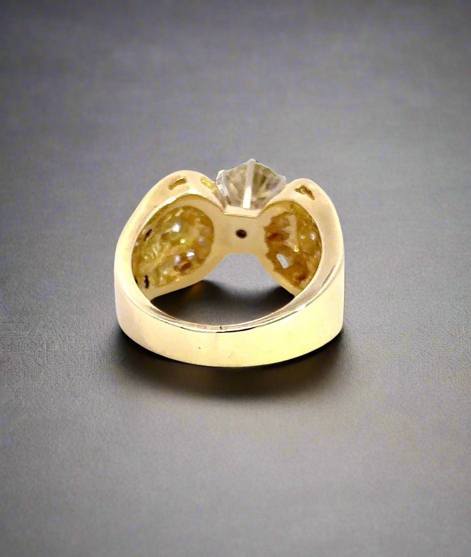 back of yellow gold ring with light scratch on band