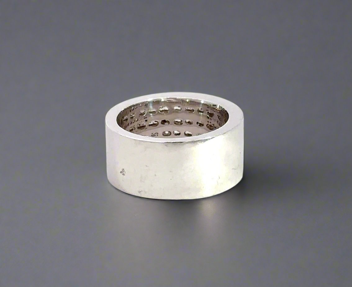 back of white gold ring with scratches and marks on gold