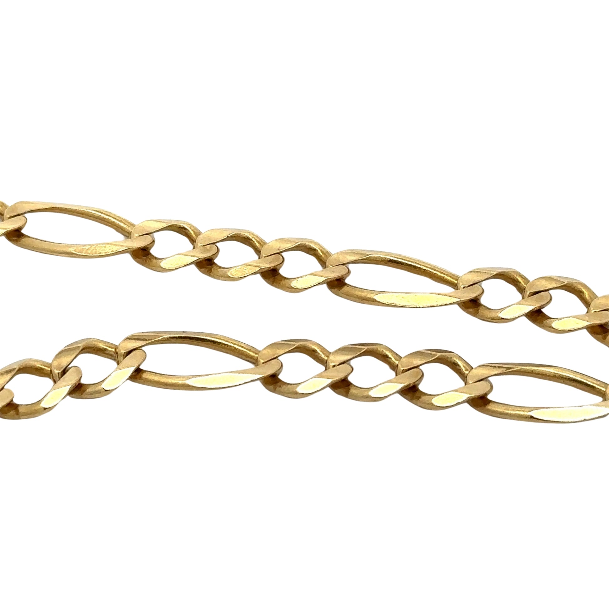 close up of yellow gold figaro link chain