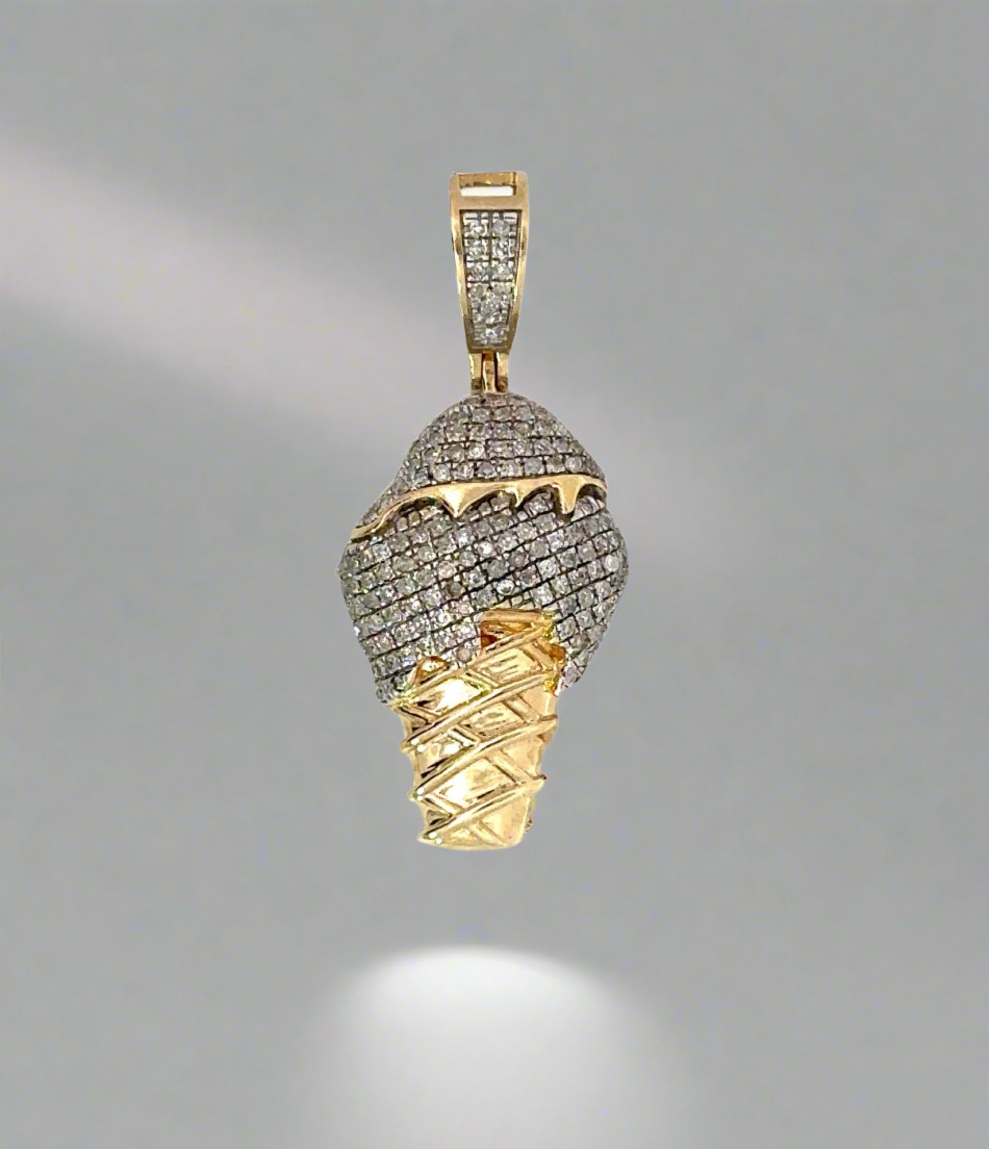 top of ice cream cone pendant in yellow gold with small round dianonds