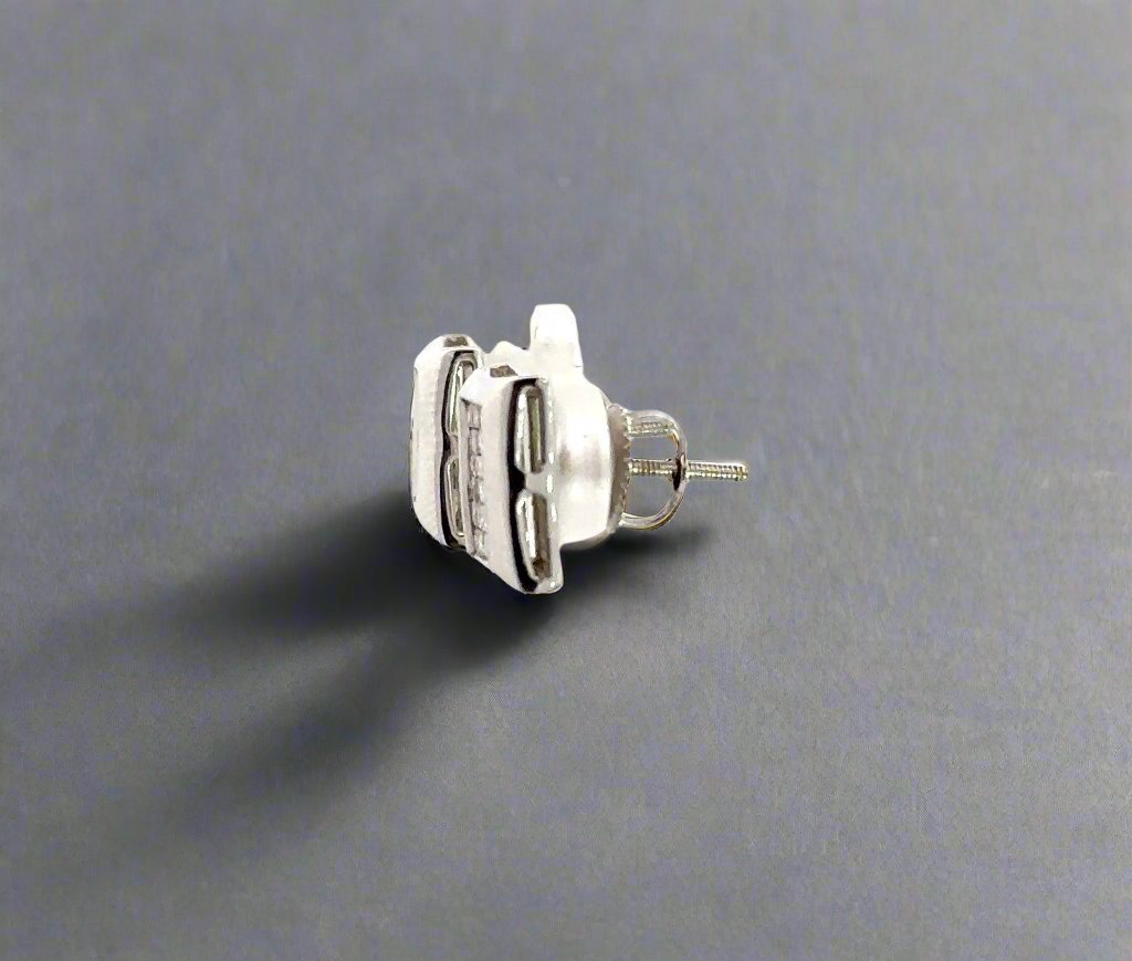 Side of white gold princess cut diamond earrings.