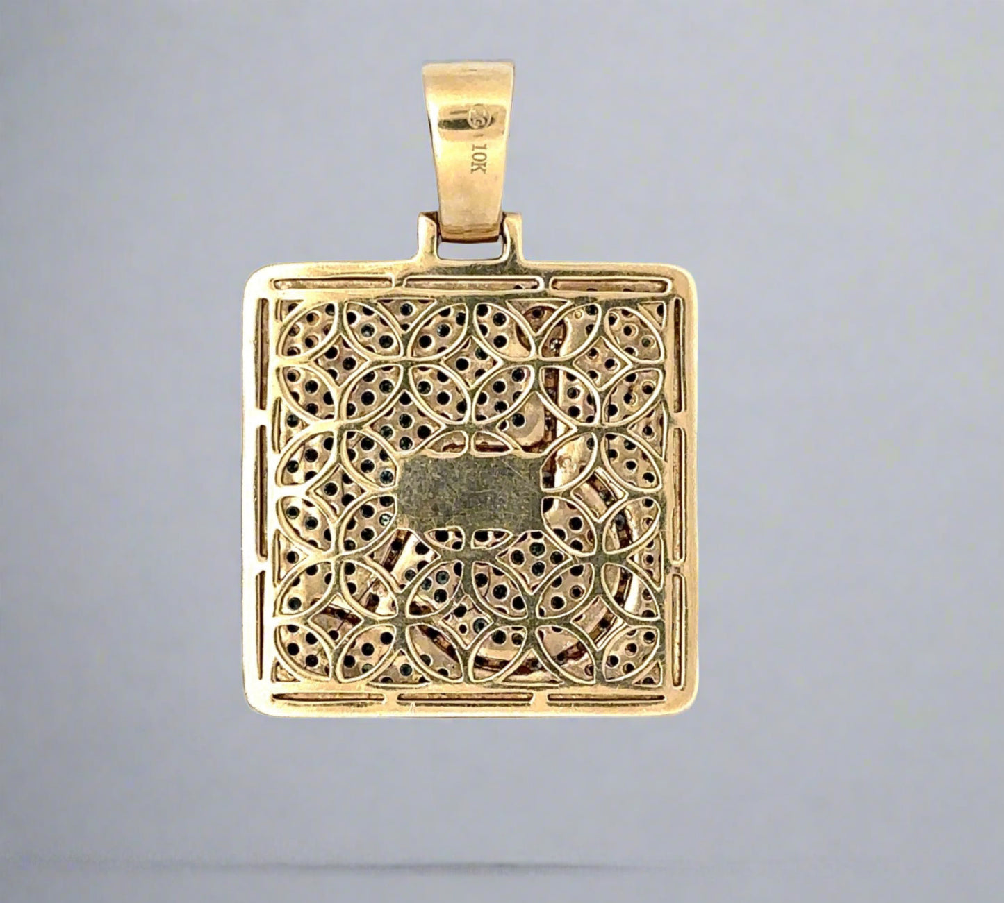 Back of pendant in yellow gold and scratches on the gold. 10K stamp on the bail.
