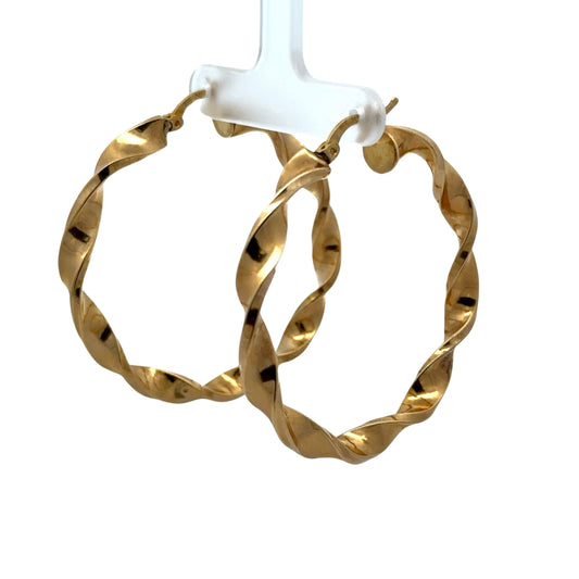 diagonal view of yellow gold twist hoops 