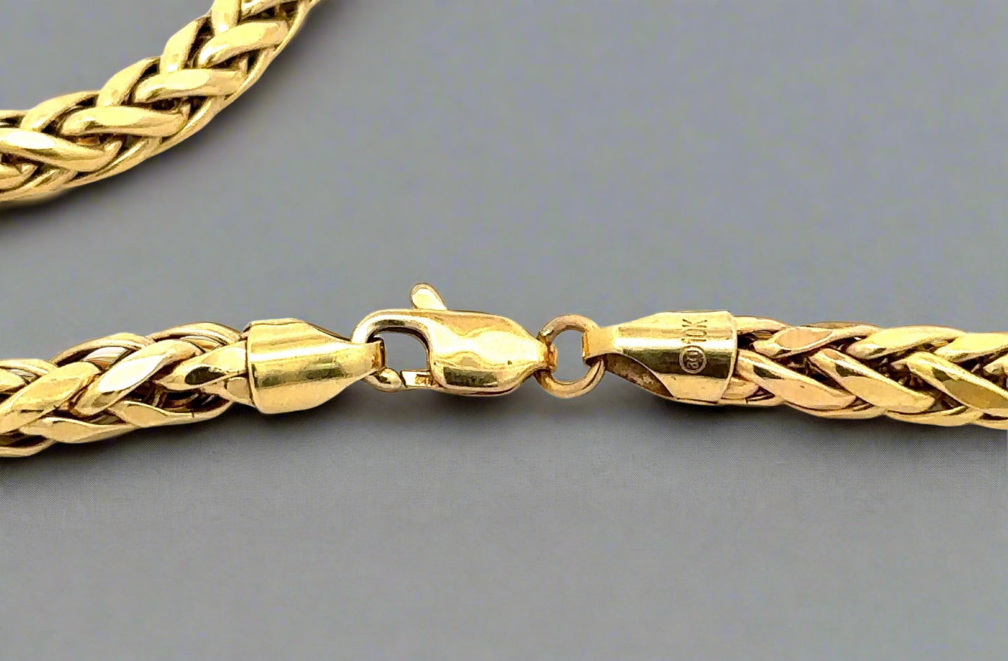 Close up of lobster clasp with 10K stamp