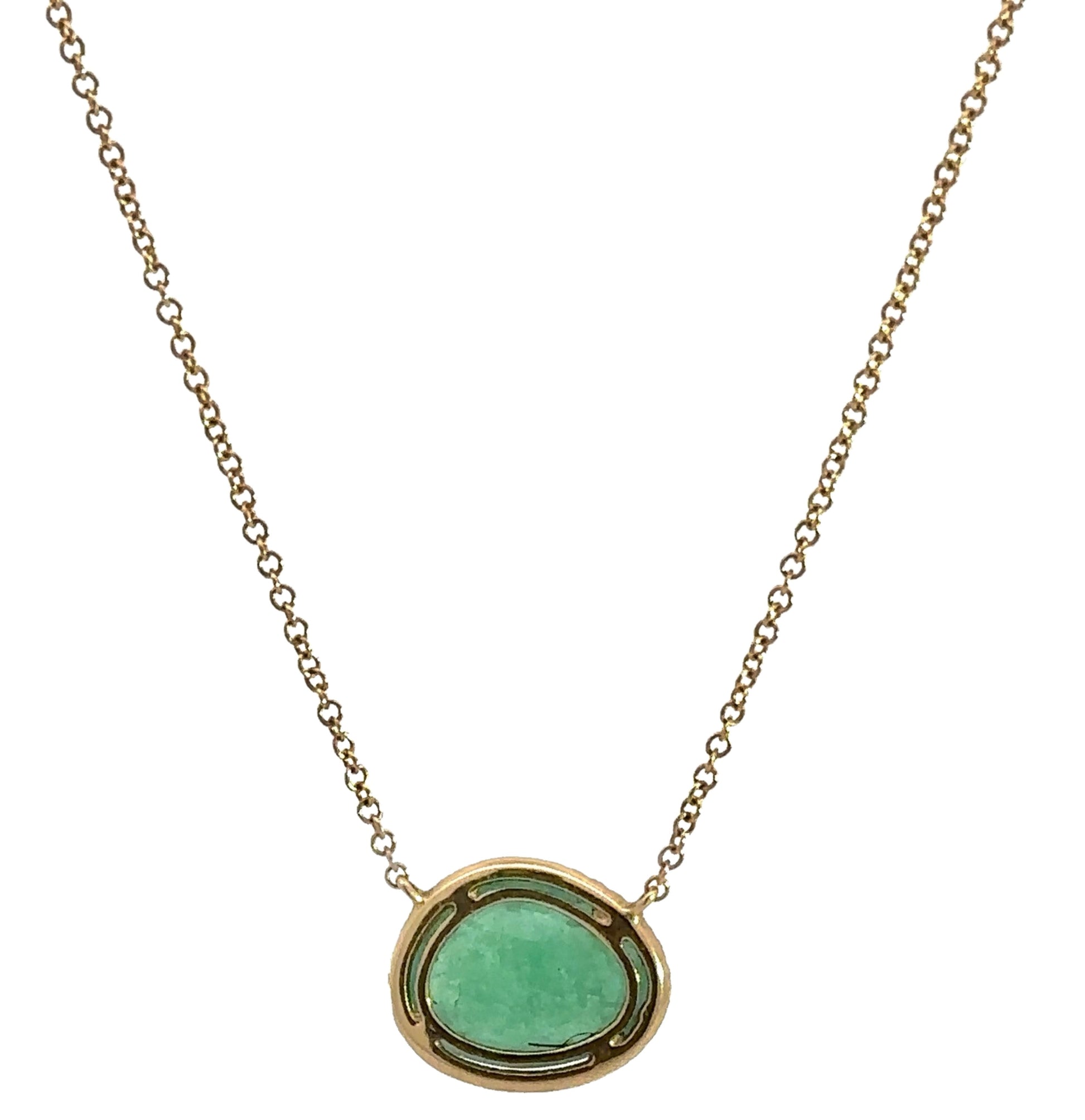 back of necklace with yellow gold surrounding free-form emerald